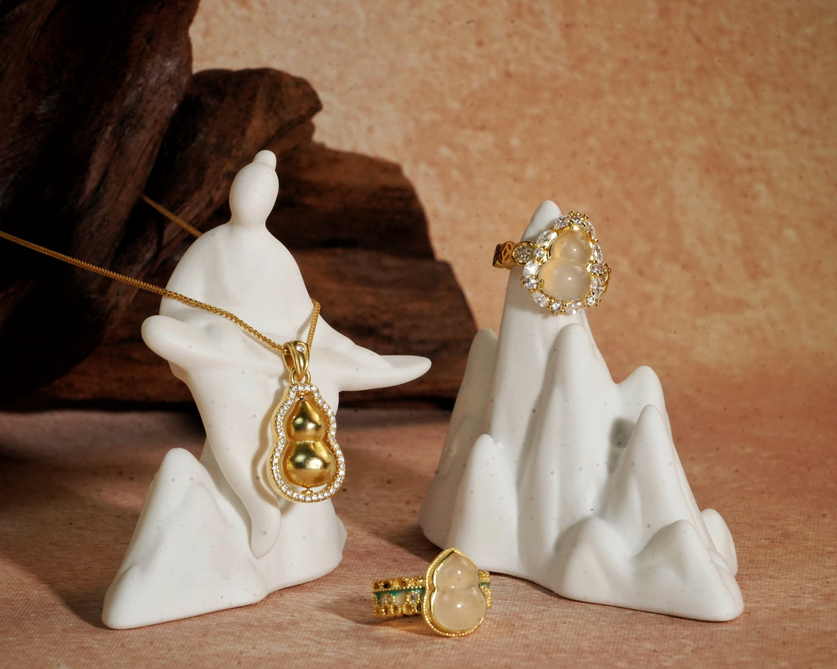 Soul Lotus symbolic jewelry arranged in a quiet still-life