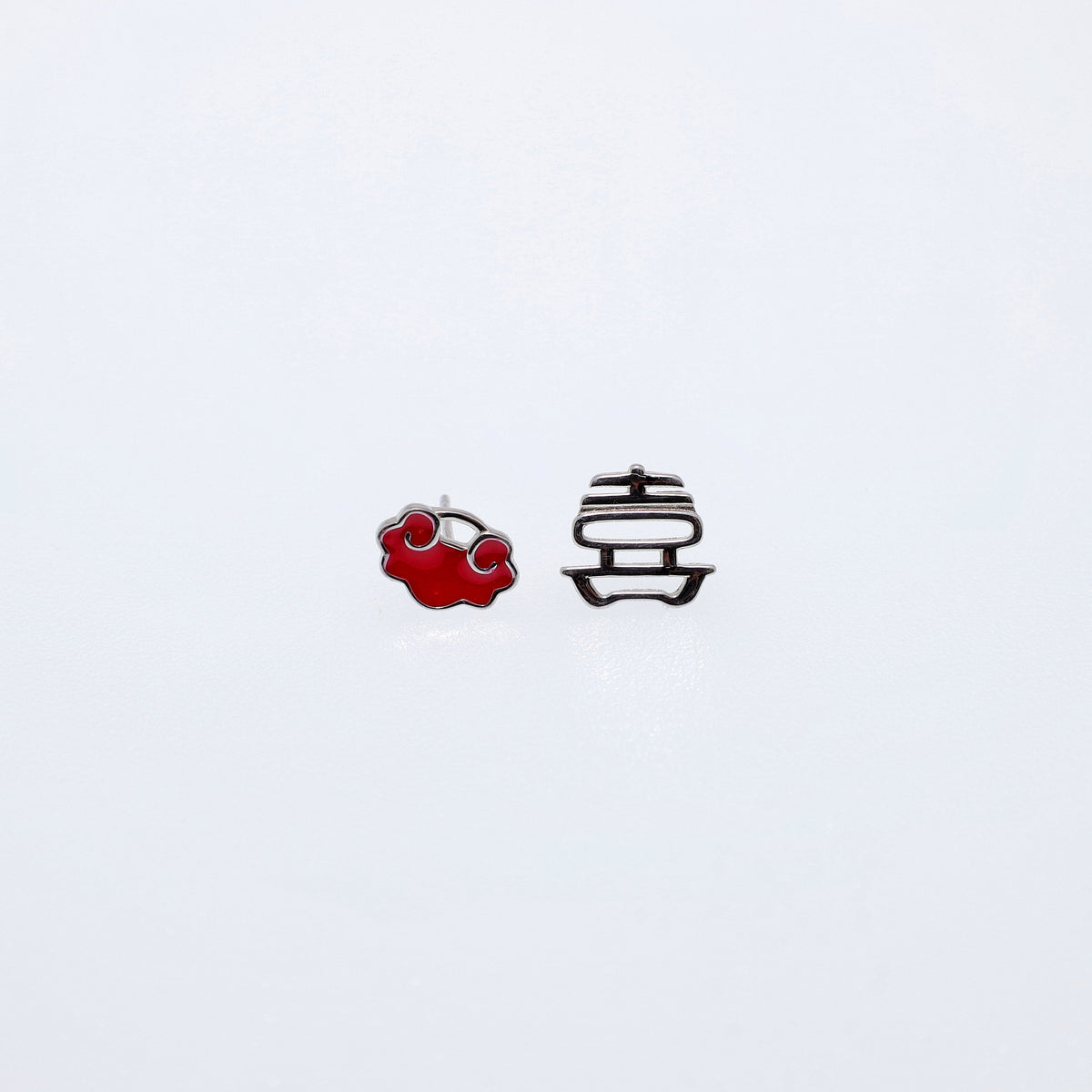 Asymmetric sterling silver earrings with a Xi character, longevity-lock form, and auspicious-cloud details