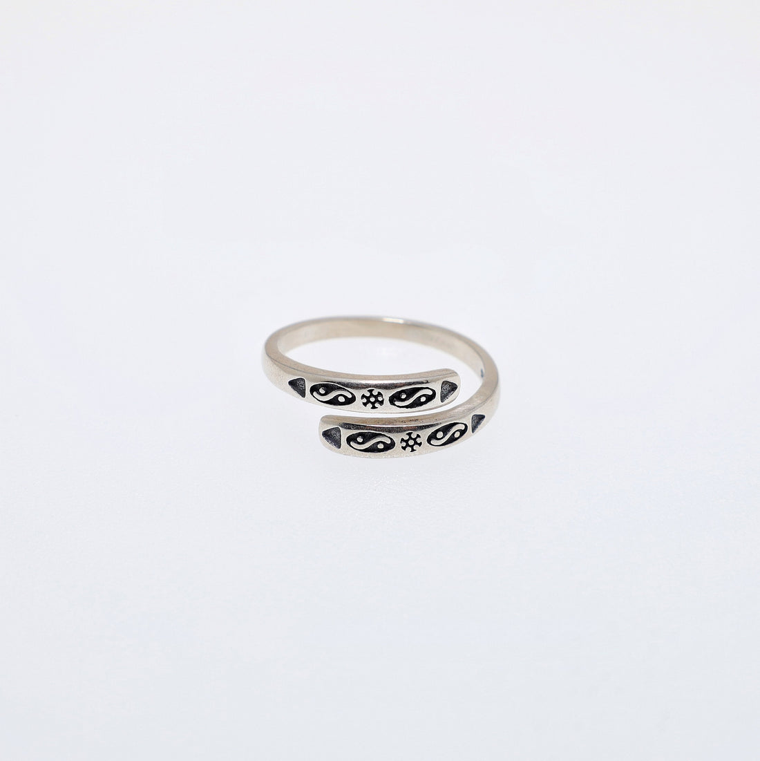 Sterling silver adjustable ring with a central Taiji-inspired form and Bagua trigram details