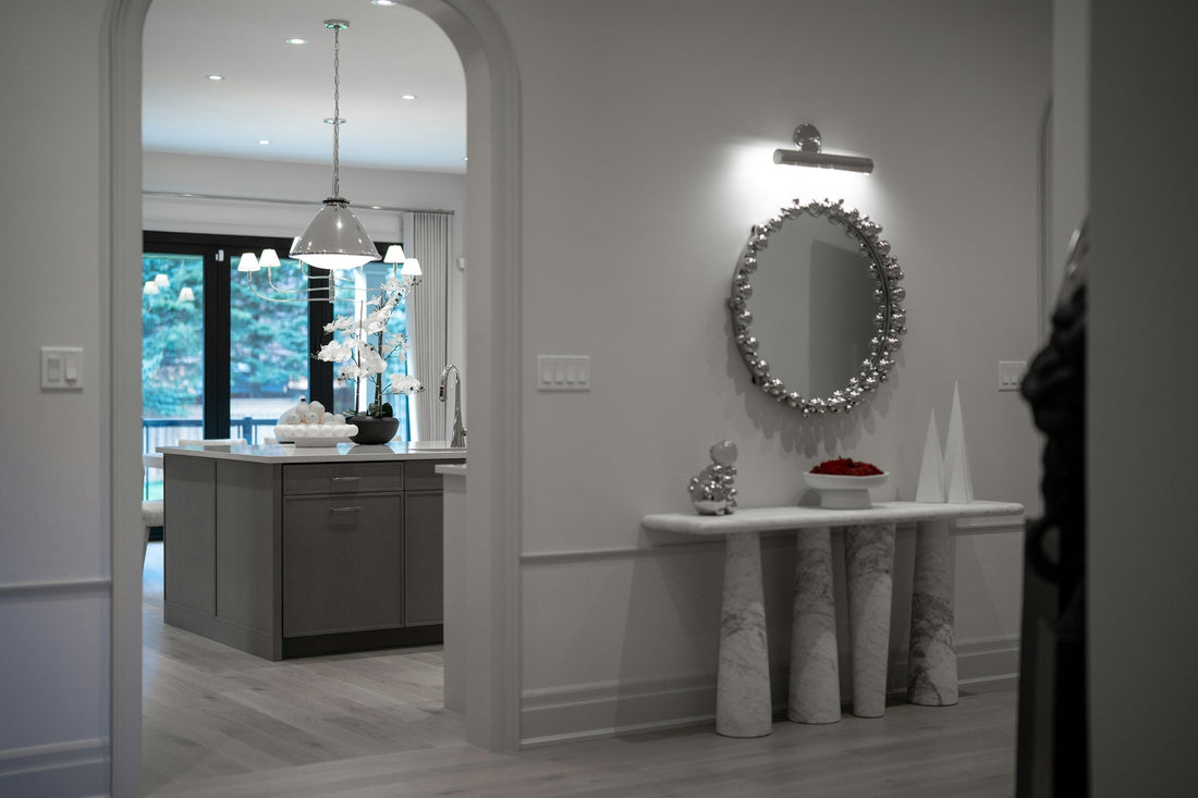 Modern entryway with a console table and mirror, illustrating clear circulation and practical entryway layout
