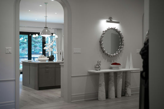 Modern entryway with a console table and mirror, illustrating clear circulation and practical entryway layout
